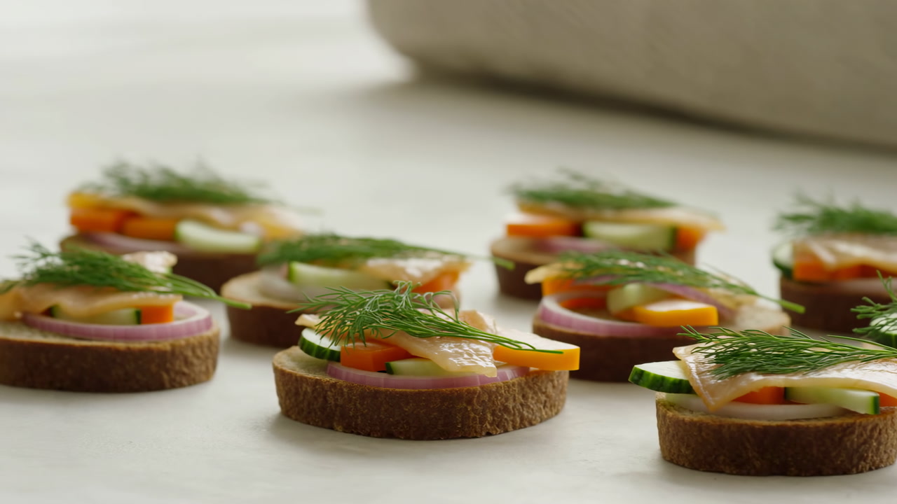 Closeup Canape Appetizers On Parchment Paper, Smoked Salmon Rounds Layered With Cucumber And Cheese, Dill
