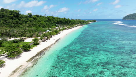 Crystal-clear-Blue-Water-Of-Lalomanu-Beach-With-Palm-Trees-And-Nu'utele-Island-In-The-Distance-In-Summer-In-Upolu-Island,-Samoa