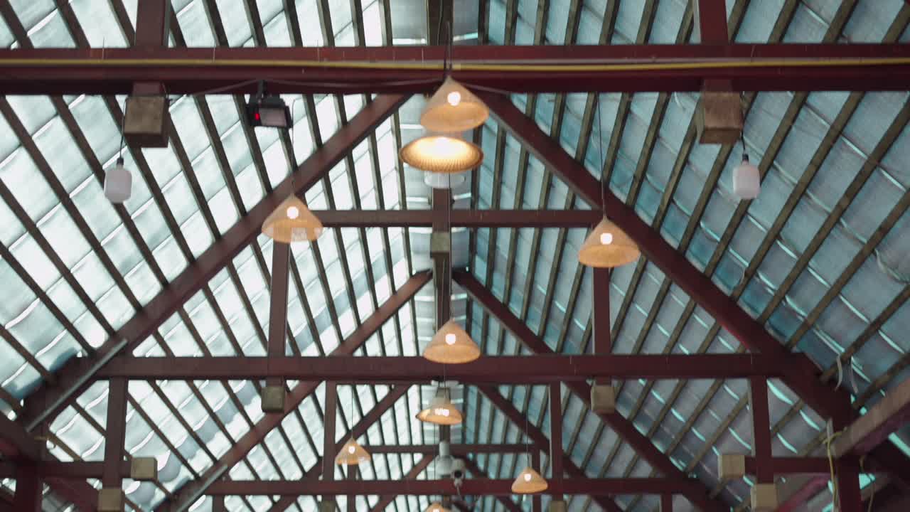 Indoor Ceiling with Wooden Beams and Hanging Lamps