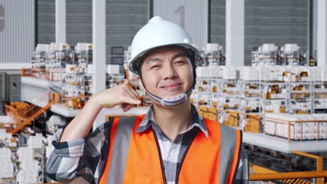 warehouse worker gesturing to call