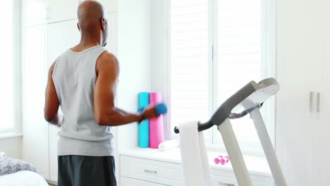 man exercising with dumbbells 4k