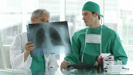 Two-doctors-looking-at-Xray
