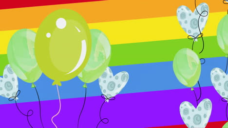animación de globos verdes y en forma de corazón en el fondo del arco iris