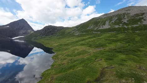 Majestic mountain lakes become a scenic playground for an FPV drone, showcasing nature&#039;s grandeur in stunning aerial maneuvers