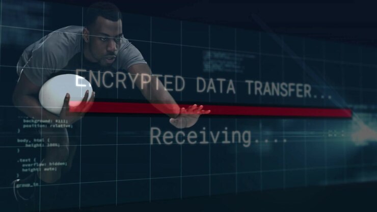 Male athlete holding white oval ball, receiving encrypted data overlay, reaching as red bar filling