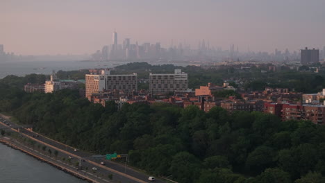 aerial view of bay ridge, brooklyn on a humid summer day. shot with the manhattan skyline in the background