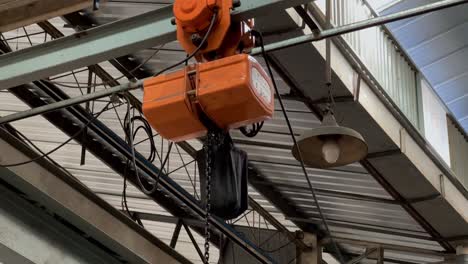 orange working overhead crane