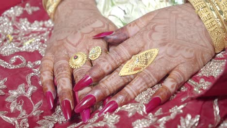 bride's hands with henna and jewelry