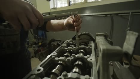 open car engine close-up. an auto mechanic in a garage repairing a car engine after removing a cover. car engine repair. car service