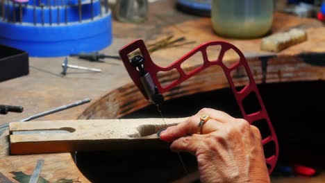 Craftswoman-working-in-workshop