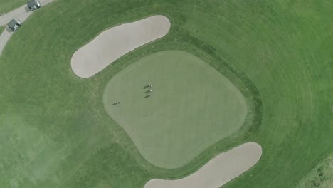 drone shot straight down on gold hole