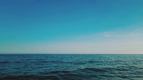 ocean waves with a clear blue sky