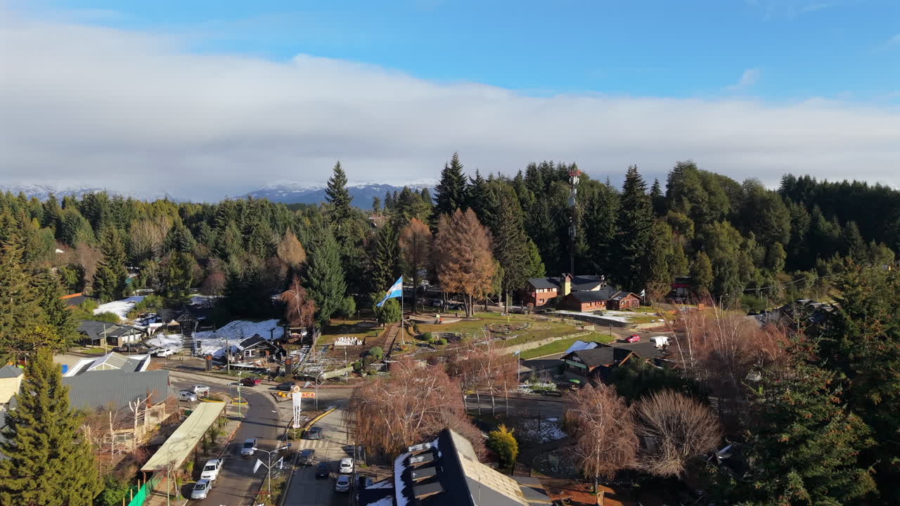 Aerial establishing fly Villa La Angostura, resort town on Nahuel Huapi Lake in Patagonia, Argentina, Daylight Panorama