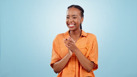 Woman,-thumbs-up-and-applause-in-studio