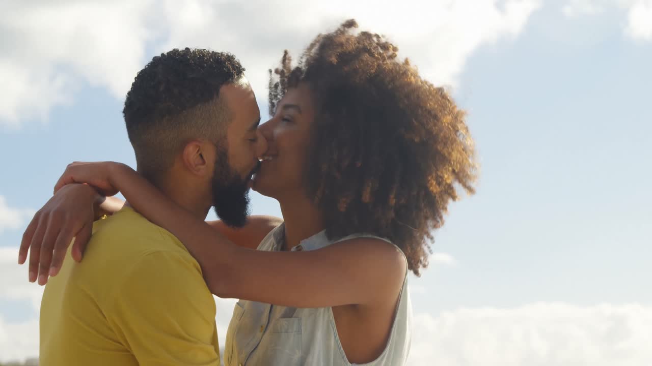 Couple embracing each other at beach 4k