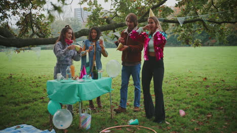 friends celebrating in a park