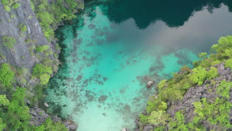 aerial view of limestone karst scenery and turquoise ocean water in coron island, palawan, philippines