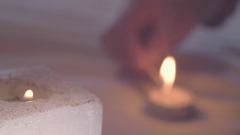 Lighting-candles-with-a-match-with-bokeh-background