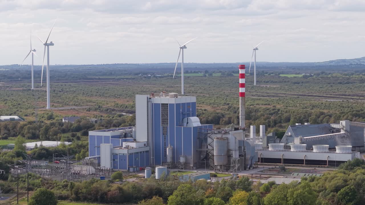 Wind Turbines Spinning Behind the Edenderry Thermal Station in Ireland
