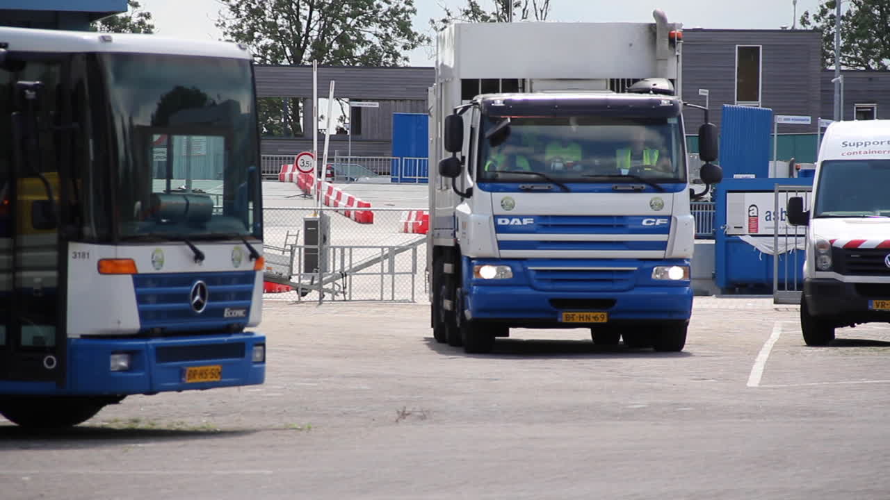 Garbage truck leaving land fill in the Netherlands - wide