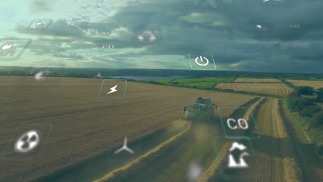 Animation-of-eco-icons-and-data-processing-over-countryside-farm-land