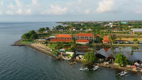 beautiful coastline beach resort in lovina bali indonesia during golden hour sunset, aerial