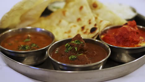 typical indian dish, mix of indian food to share at the restaurant