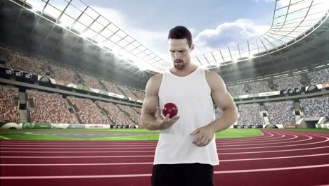 Male-athlete-preparing-to-throw-shot-put-ball