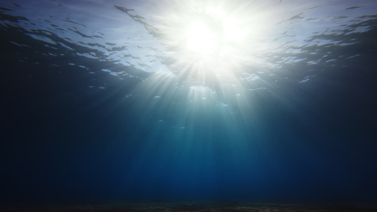 Rays of Sunlight Pass Through the Calm Ocean During a Spiritual Concentration