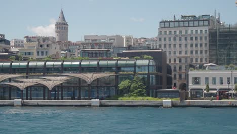 istanbul waterfront with galata tower and modern buildings