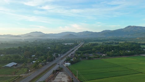 Duarte highway, countryside, green rice fields, Bonao in Dominican Republic, sky for copy space, Aerial drone pov