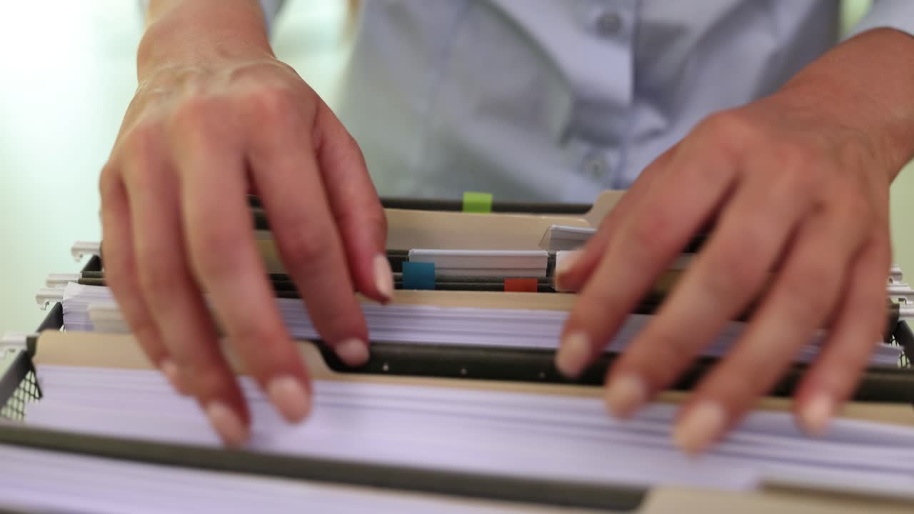 Hands Organizing Files