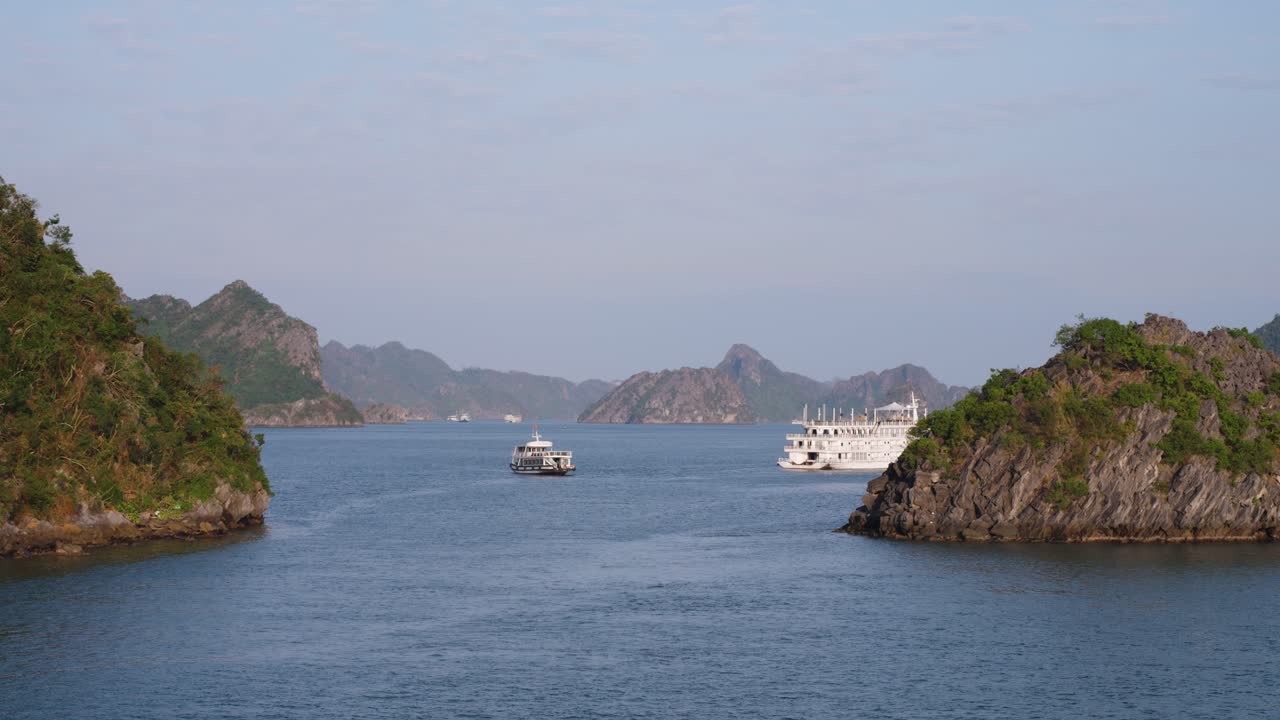 Cruise Ships Cruising in Ha Long Bay Waters by Karst Limestone Mountains, Vietnam - static