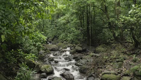 Excellent-Aerial-Shot-Over-A-Mountain-Stream-In-Costa-Rica