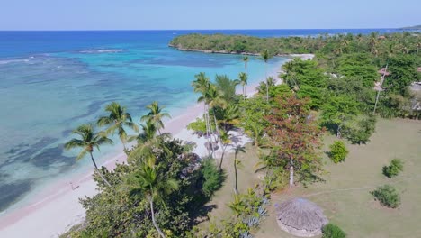 people at playa la playita beach at las galeras in samana peninsula, dominican republic