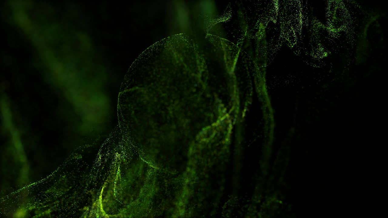 поток зеленых светящихся частиц под водой на черном фоне впадает в сферическое поле, место для вашего текста, логотипа. альфа-канал как люма-матт. эффект чернил адвекции.