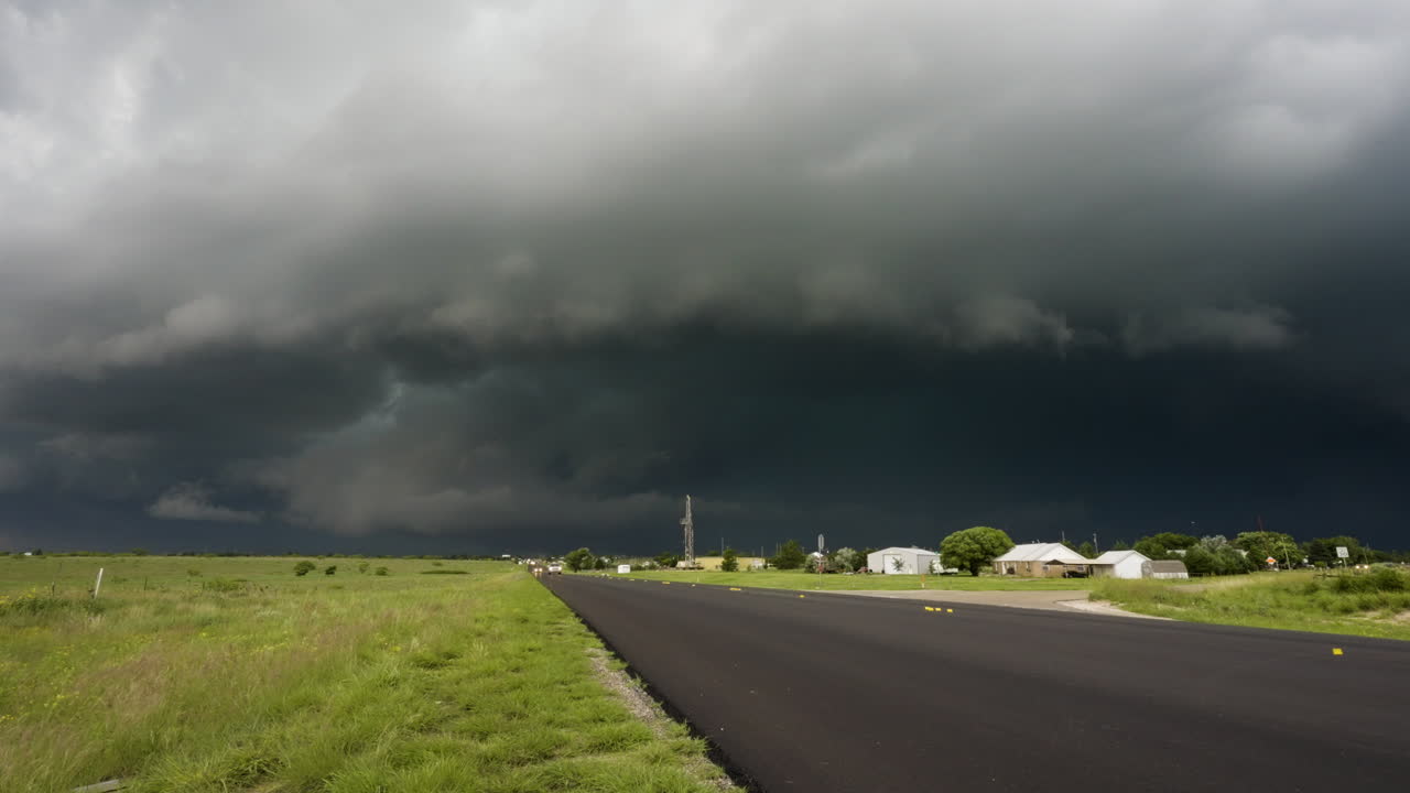 Dark Storm Clouds Moving Over Country Road Time Lapse