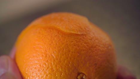 peeling an orange for cocktail and desserts