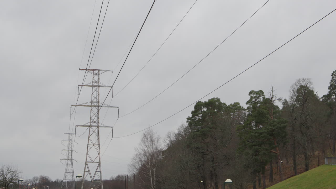 High voltage power lines running through green park, tilt, Stockholm