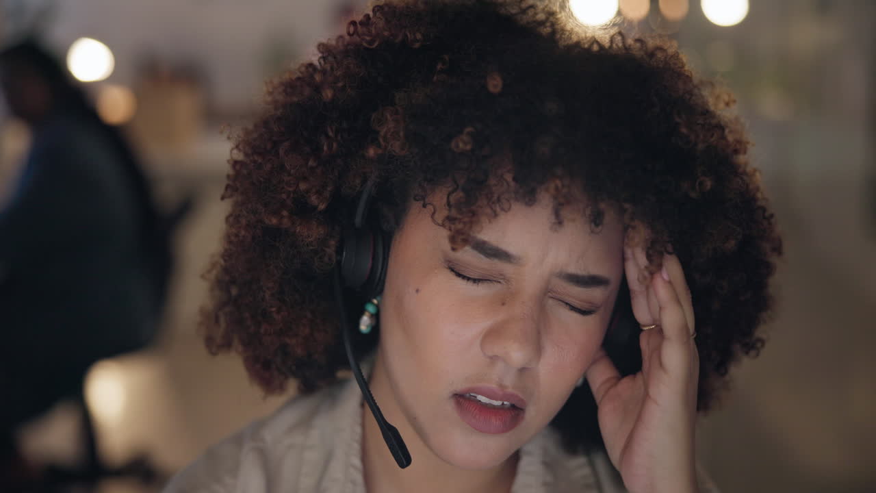 Headache, tired and pain of woman in call center