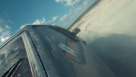 off-road vehicle in a dusty landscape