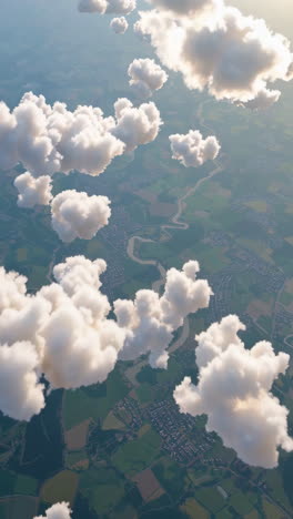 aerial view of clouds over rural landscape and town