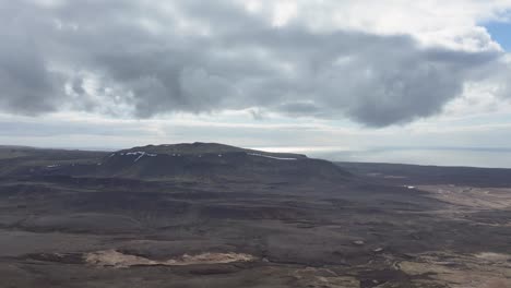 Breathtaking-volcanic-landscape,-likely-in-Iceland,-showcases-steaming-ground-and-intense-heat,-highlighting-the-country's-unique-geothermal-activity