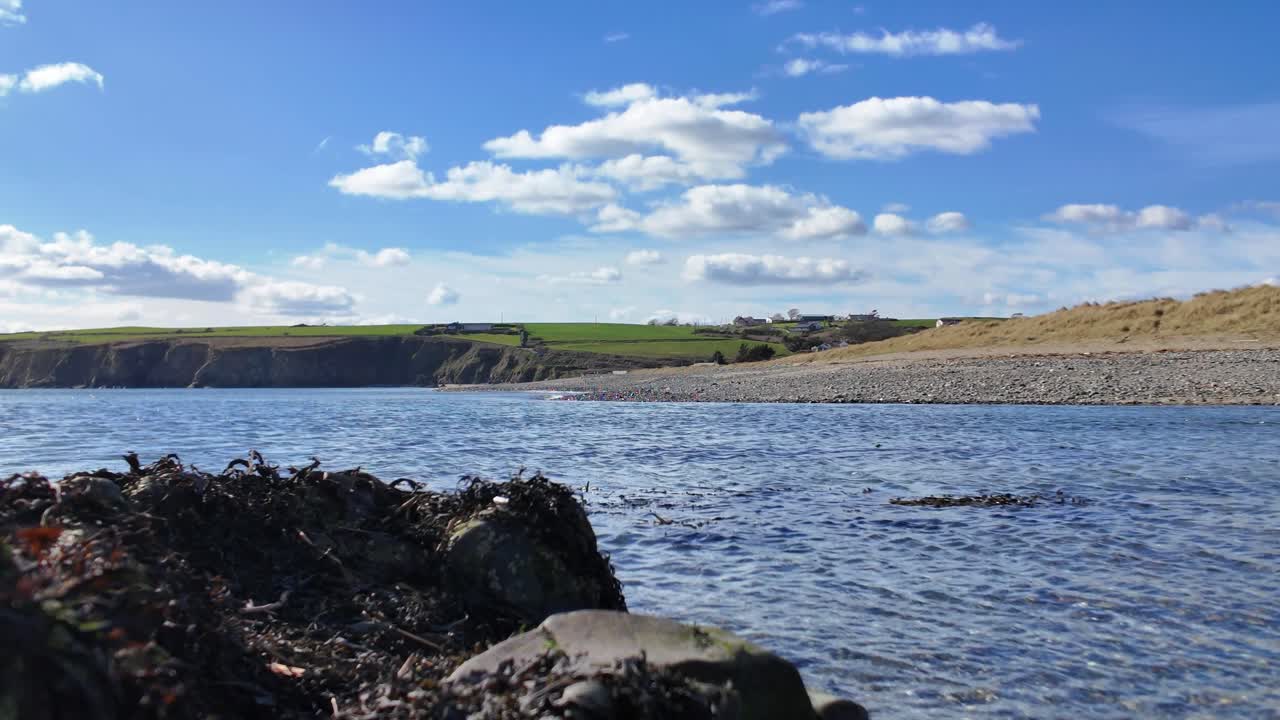 Ireland Epic Locations fast flowing ebb tide at Bunmahon Beach Copper Coast Waterford spring tides