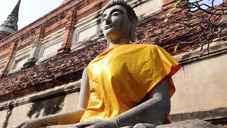 buddha statue with yellow robe in ayutthaya