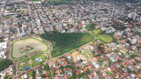 top-down aerial view of the central park with artificial lake in the middle of the toledo city neighborhood, paraná, brazil.