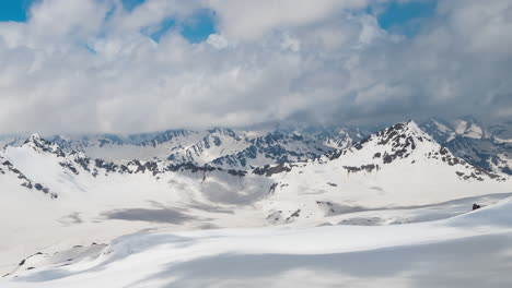 Timelapse-Mountain-clouds-over-beautiful-snow-capped-peaks-of-mountains-and-glaciers.