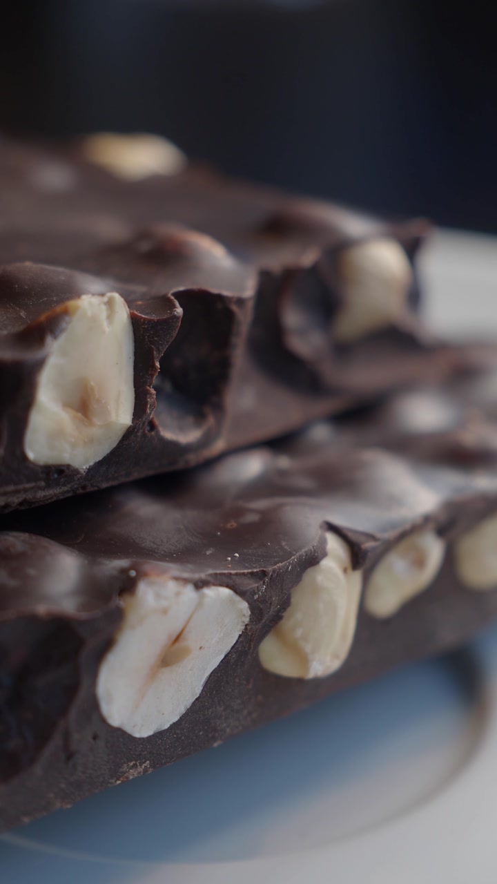 Close-up of Dark Chocolate Bar with Hazelnuts