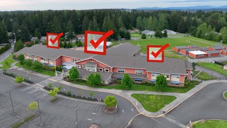 aerial view of a public school with voting checkmarks appearing overhead