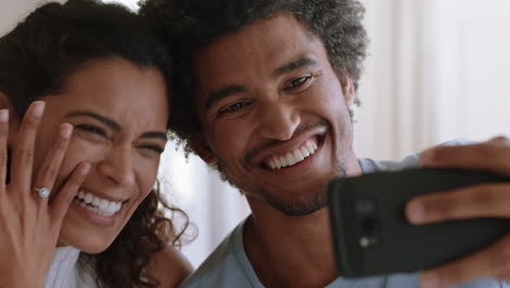 happy couple video chatting on smartphone beautiful woman showing wedding ring enjoying romantic celebration